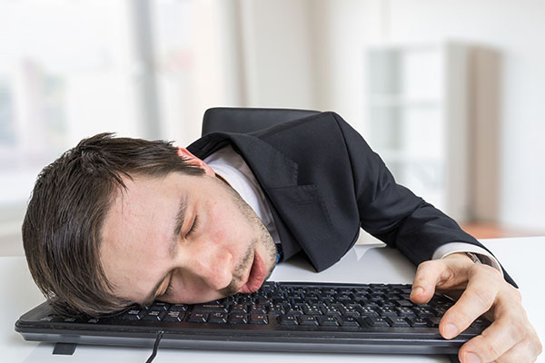 Exhausted or tired businessman is sleeping on keyboard in office Guzmans Garden Centers The Glory of Gardening